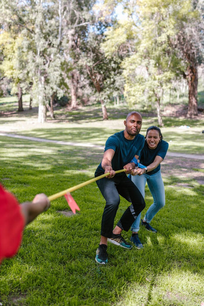 Man And Woman Playing Tug-of-war